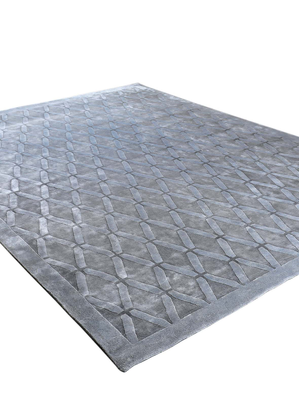 Luxury hand tufted carpet made from 100% Bamboo Silk in silver grey color and 4'6" x 6'6" size